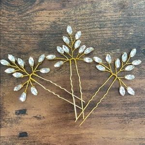 Set of three gold crystal wedding hair pins